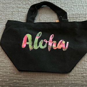 Black mini bag with Aloha print on the front